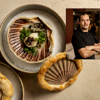 Coquille in de schelp gegaard omlegd met zoutdeeg en truffel, topinamboer aardpeer